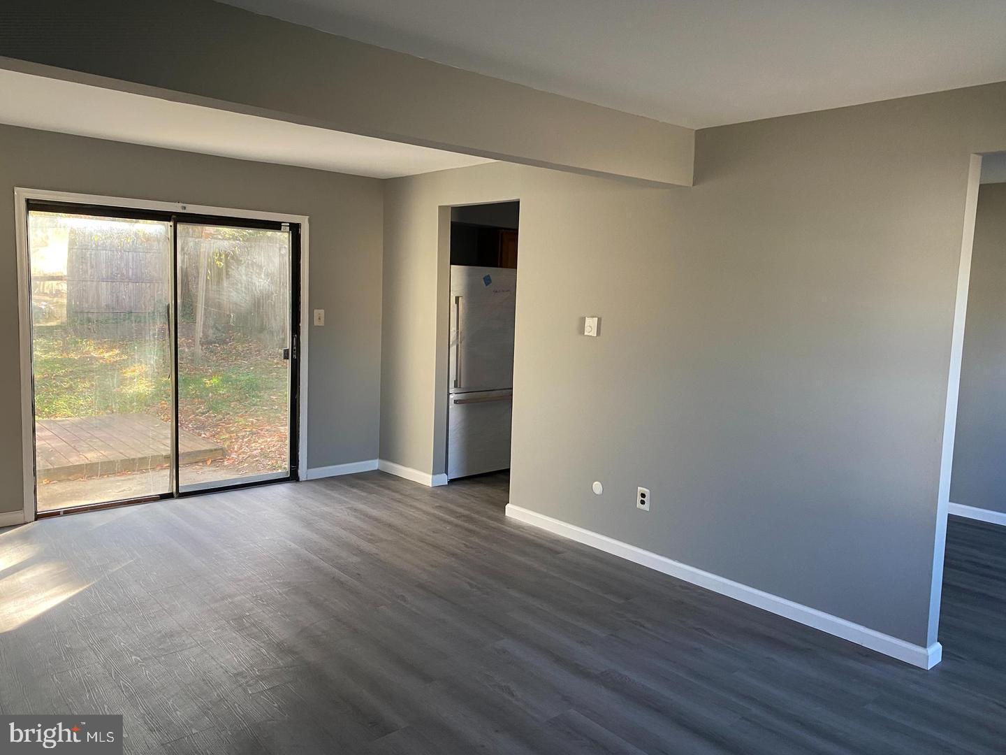 14 Berkshire Road Sicklerville, NJ 08081 - Photo 7 of 15 an empty room with wooden floor and windows