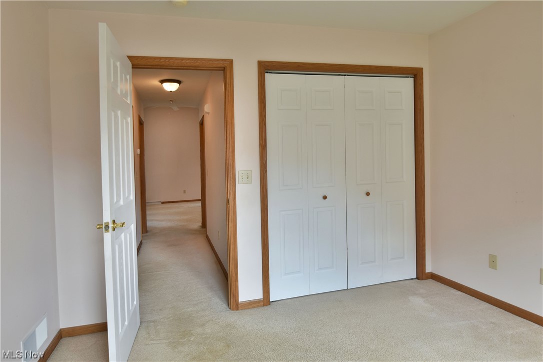 2033 East River Road, Unit 11 Newton Falls, OH 44444 - Photo 29 of 35 Bedroom with light carpet