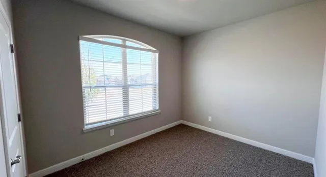 a bathroom with a shower sink vanity and mirror