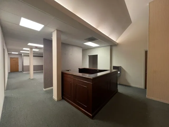 a kitchen with stainless steel appliances granite countertop a stove and a refrigerator