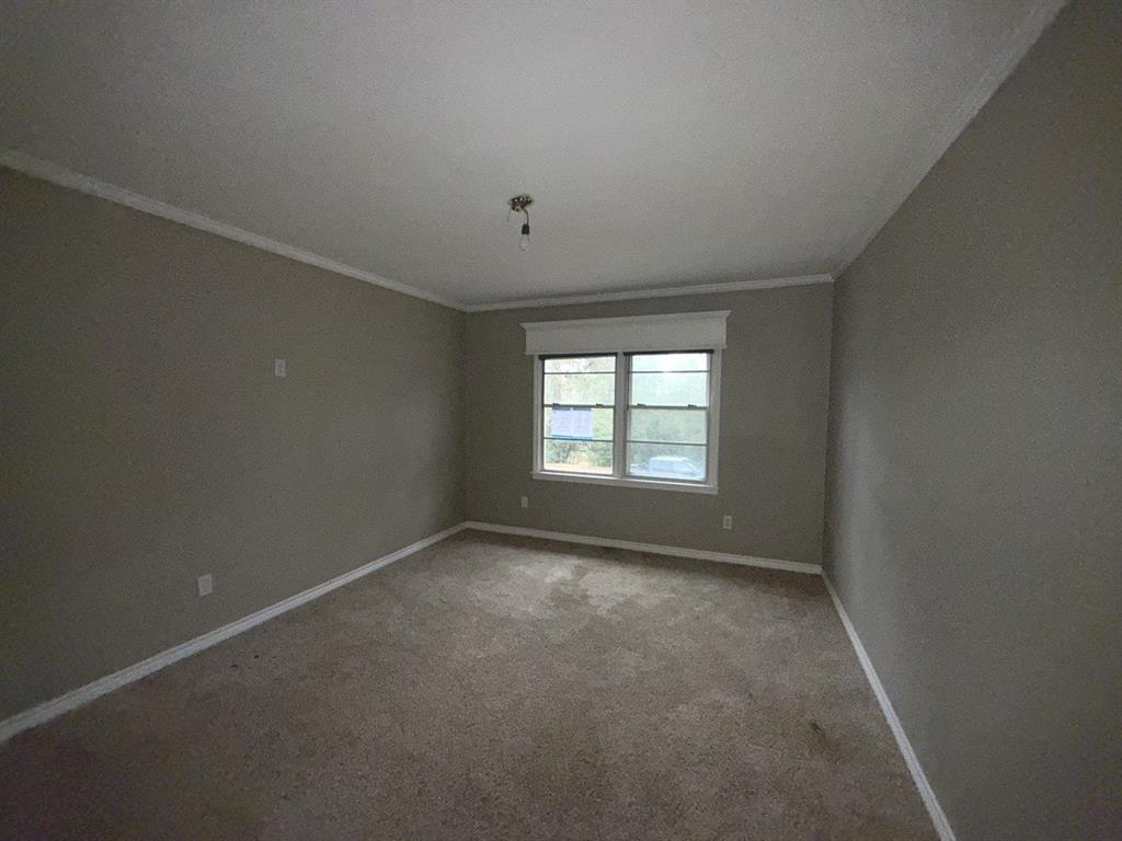 206 Summit Drive Gilmer, TX 75644 - Photo 18 of 23 an empty room with a empty space and windows