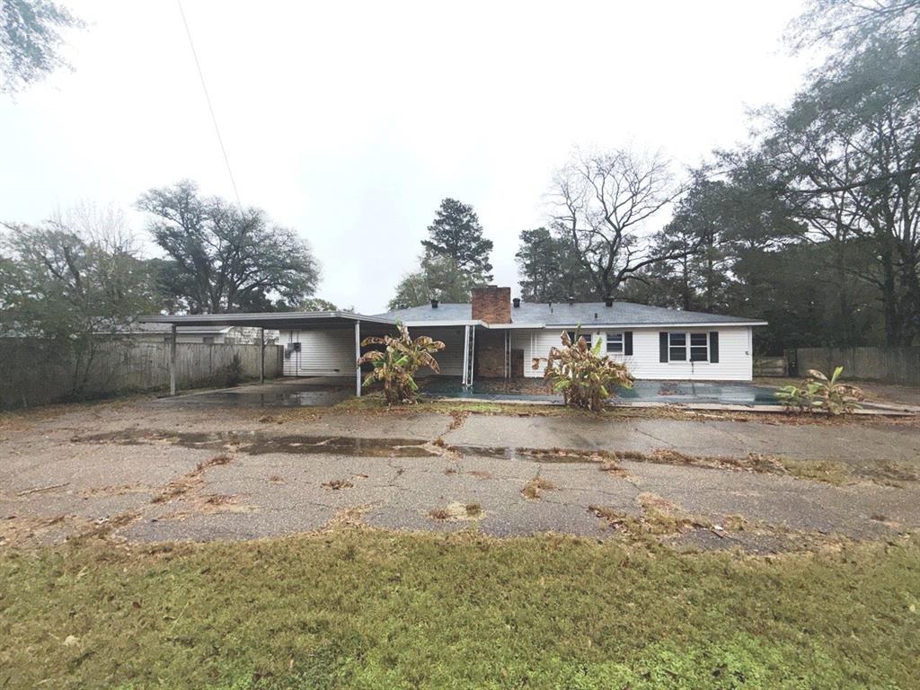 206 Summit Drive Gilmer, TX 75644 - Photo 20 of 23 a front view of a house with a yard