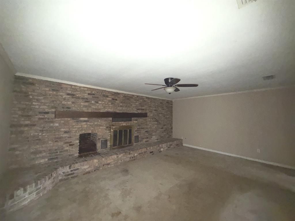 206 Summit Drive Gilmer, TX 75644 - Photo 2 of 23 a view of a livingroom with a fireplace