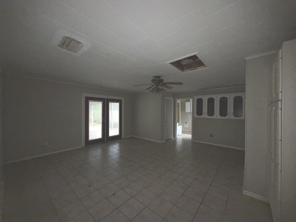 206 Summit Drive Gilmer, TX 75644 - Photo 5 of 23 a view of empty room with window