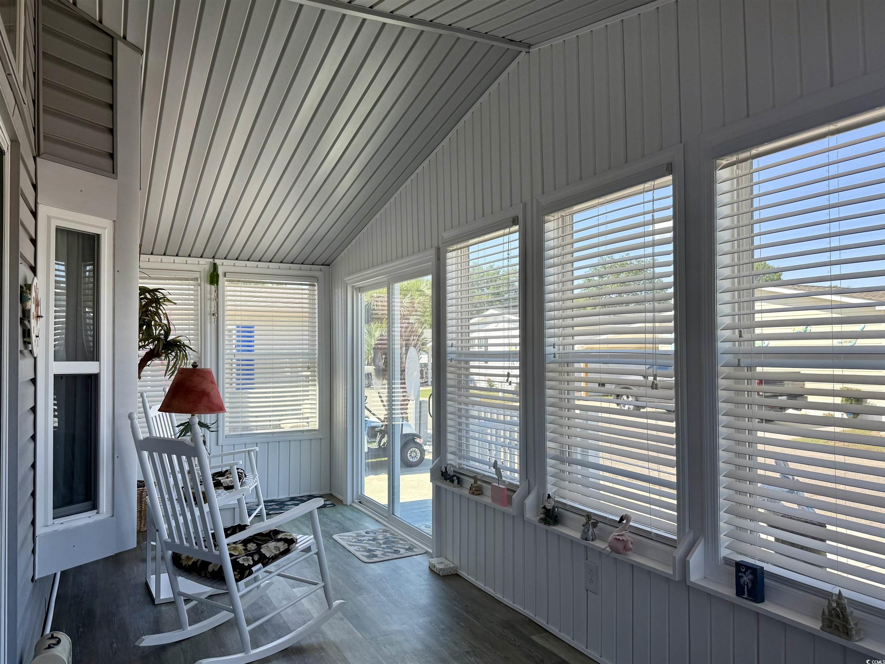 505 Sandpebble Surfside Beach, SC 29575 - Photo 17 of 27 Sunroom featuring vaulted ceiling and wood finished floors