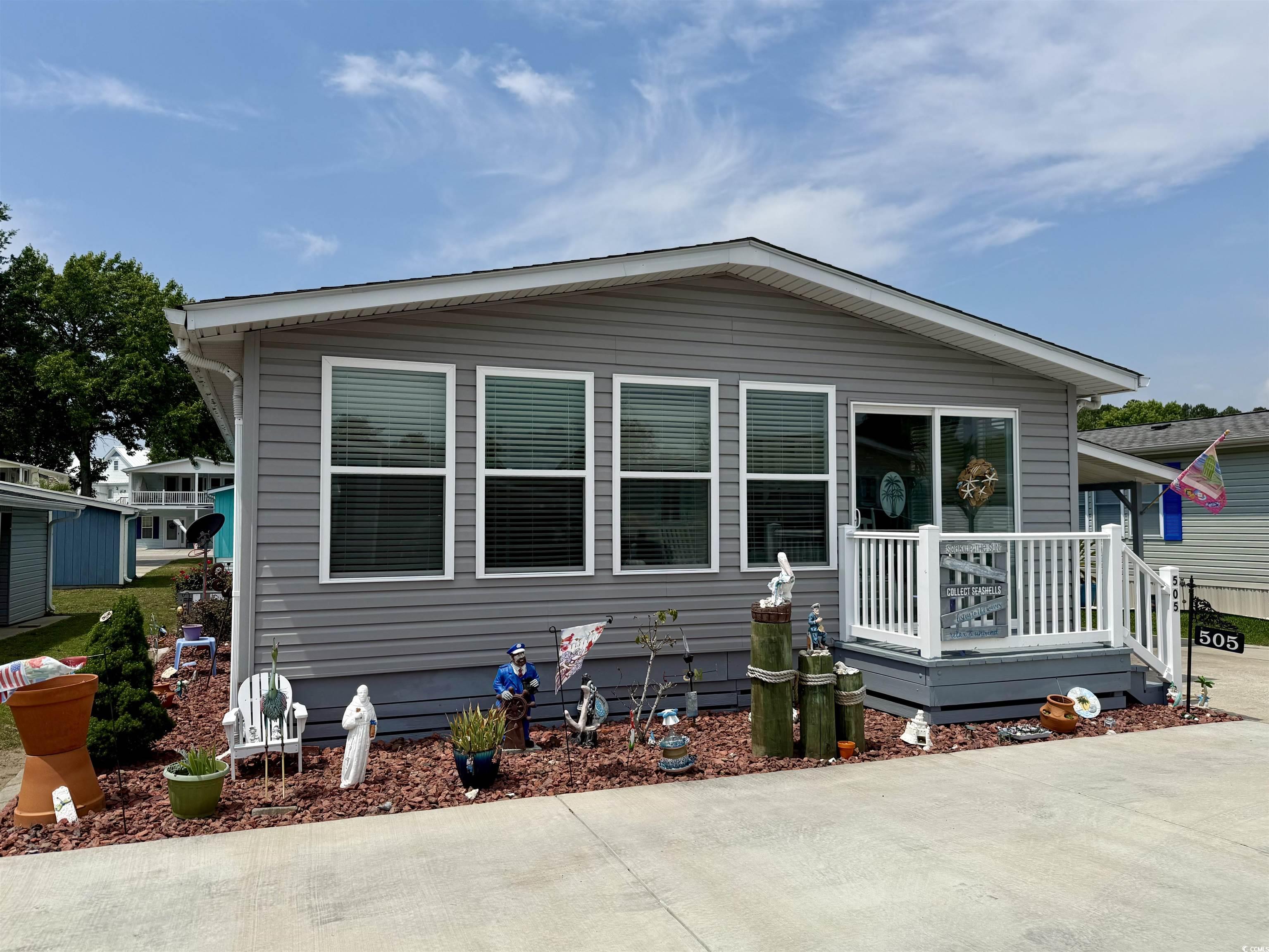 505 Sandpebble Surfside Beach, SC 29575 - Photo 19 of 27 Manufactured / mobile home with concrete driveway