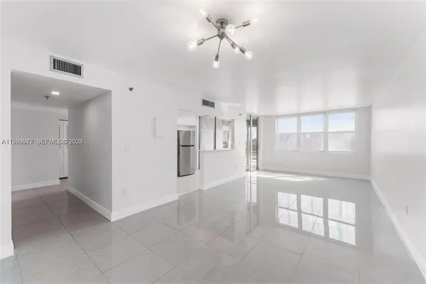 a view of an empty room with a window