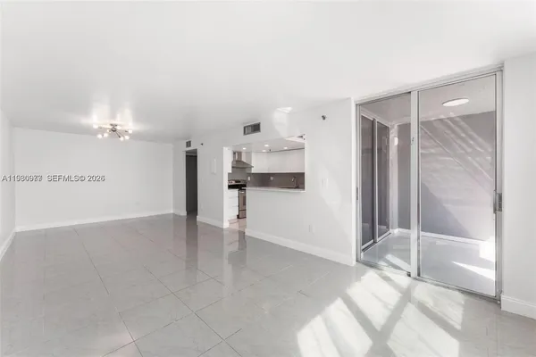 a view of an empty room with a window