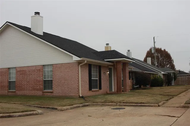 a view of a house with a street