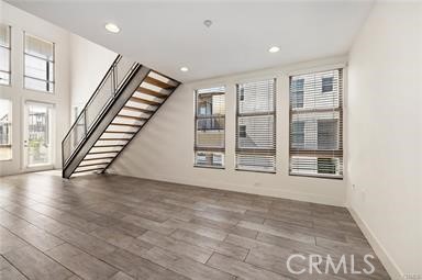 536 North Brea Boulevard Brea, CA 92821 - Photo 12 of 30 a view of an empty room with wooden floor and stairs