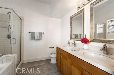 536 North Brea Boulevard Brea, CA 92821 - Photo 19 of 30 a bathroom with a sink and mirror with toilet