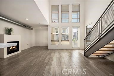 536 North Brea Boulevard Brea, CA 92821 - Photo 20 of 30 wooden floor in an empty room with a fireplace and wooden floor
