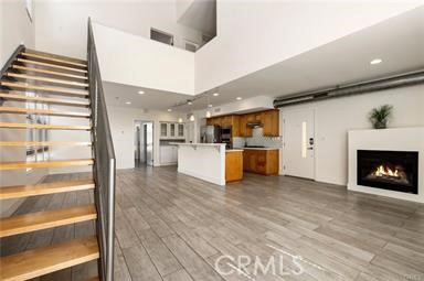 536 North Brea Boulevard Brea, CA 92821 - Photo 3 of 30 a view of a living room a kitchen with furniture and a fireplace
