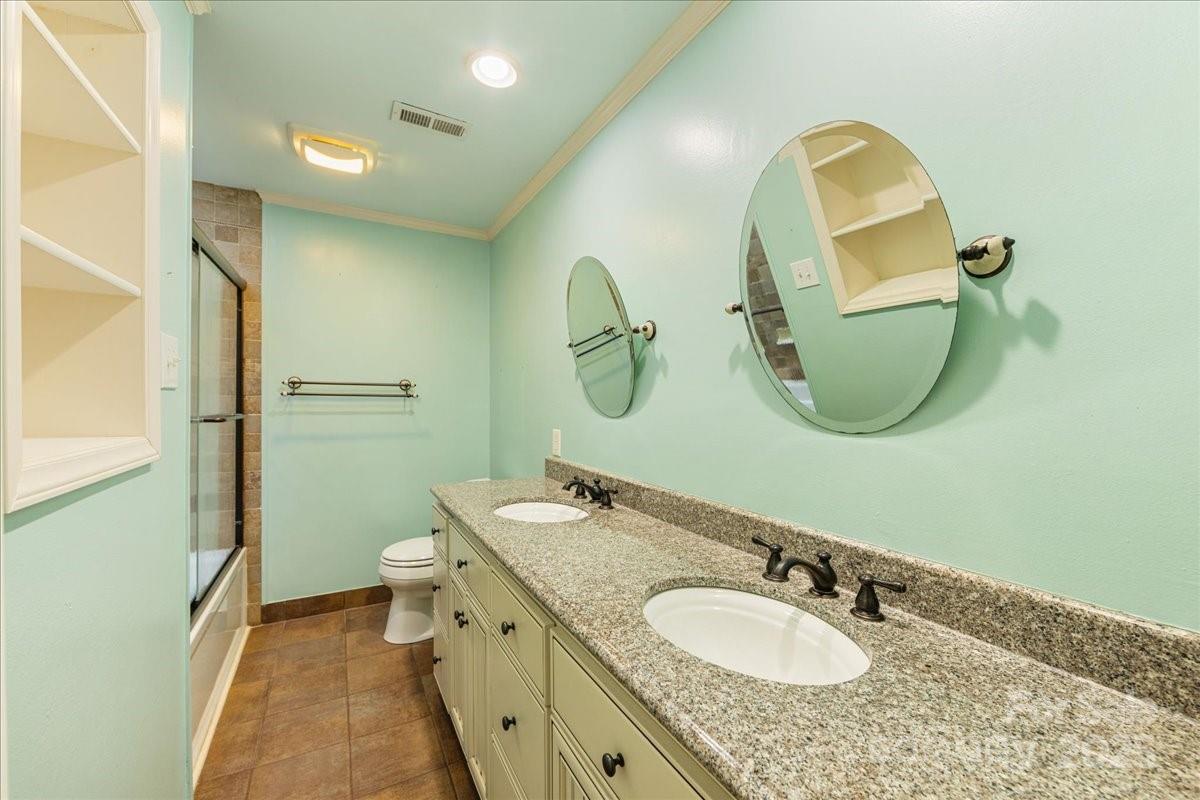 3212 Nancy Creek Road Charlotte, NC 28270 - Photo 23 of 44 a bathroom with a granite countertop double vanity sink and a mirror