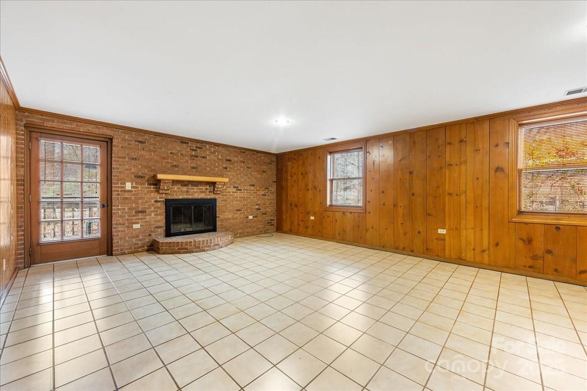 3212 Nancy Creek Road Charlotte, NC 28270 - Photo 28 of 44 a view of an empty room with a fireplace and a window