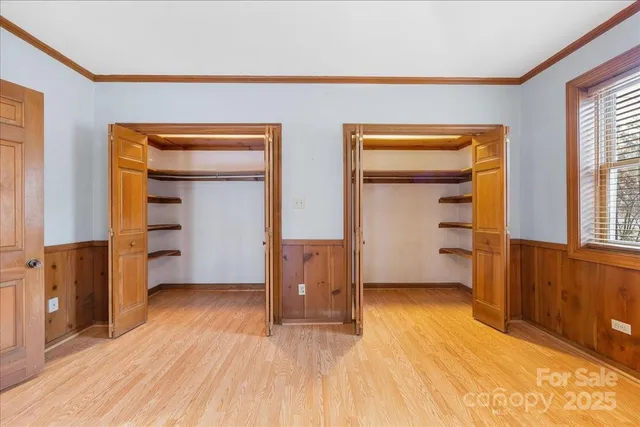 a bathroom with a double vanity sink mirror and shower