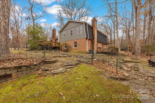 a view of a yard with trees