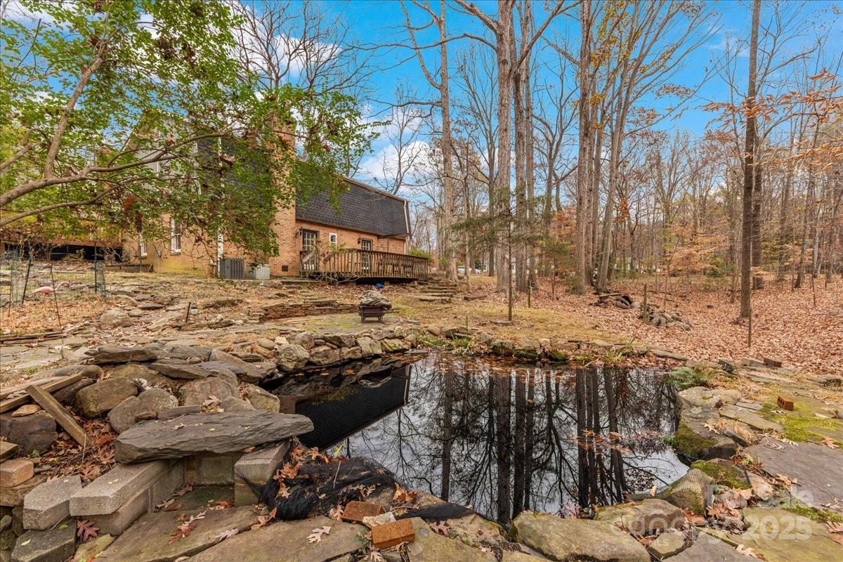3212 Nancy Creek Road Charlotte, NC 28270 - Photo 39 of 44 a view of a yard with trees