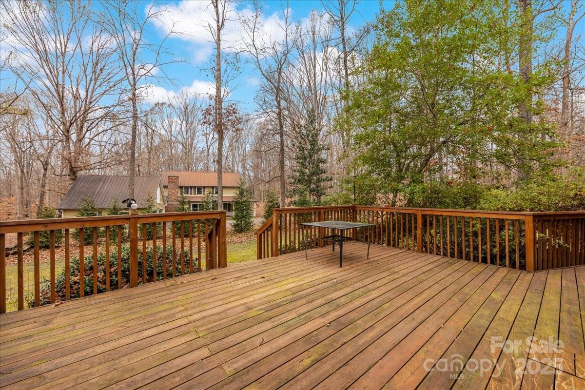 3212 Nancy Creek Road Charlotte, NC 28270 - Photo 40 of 44 a view of a deck with wooden floor and trees