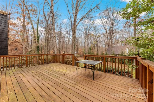 a view of backyard with deck and wooden floor