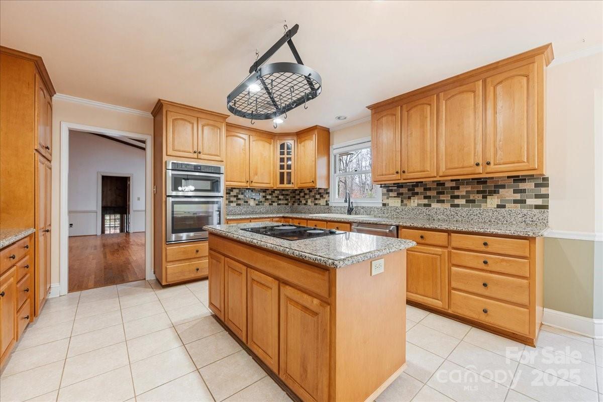 3212 Nancy Creek Road Charlotte, NC 28270 - Photo 6 of 44 a kitchen with stainless steel appliances granite countertop a stove a sink and a refrigerator