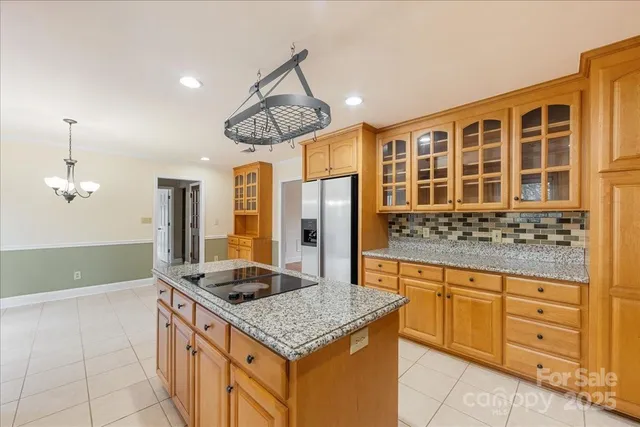 a kitchen with stainless steel appliances granite countertop a sink and cabinets