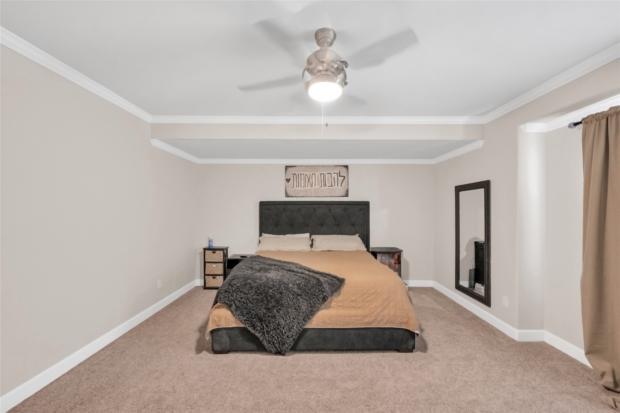 5014 Lillian Street Houston, TX 77007 - Photo 15 of 24 a bedroom with a bed and a chandelier