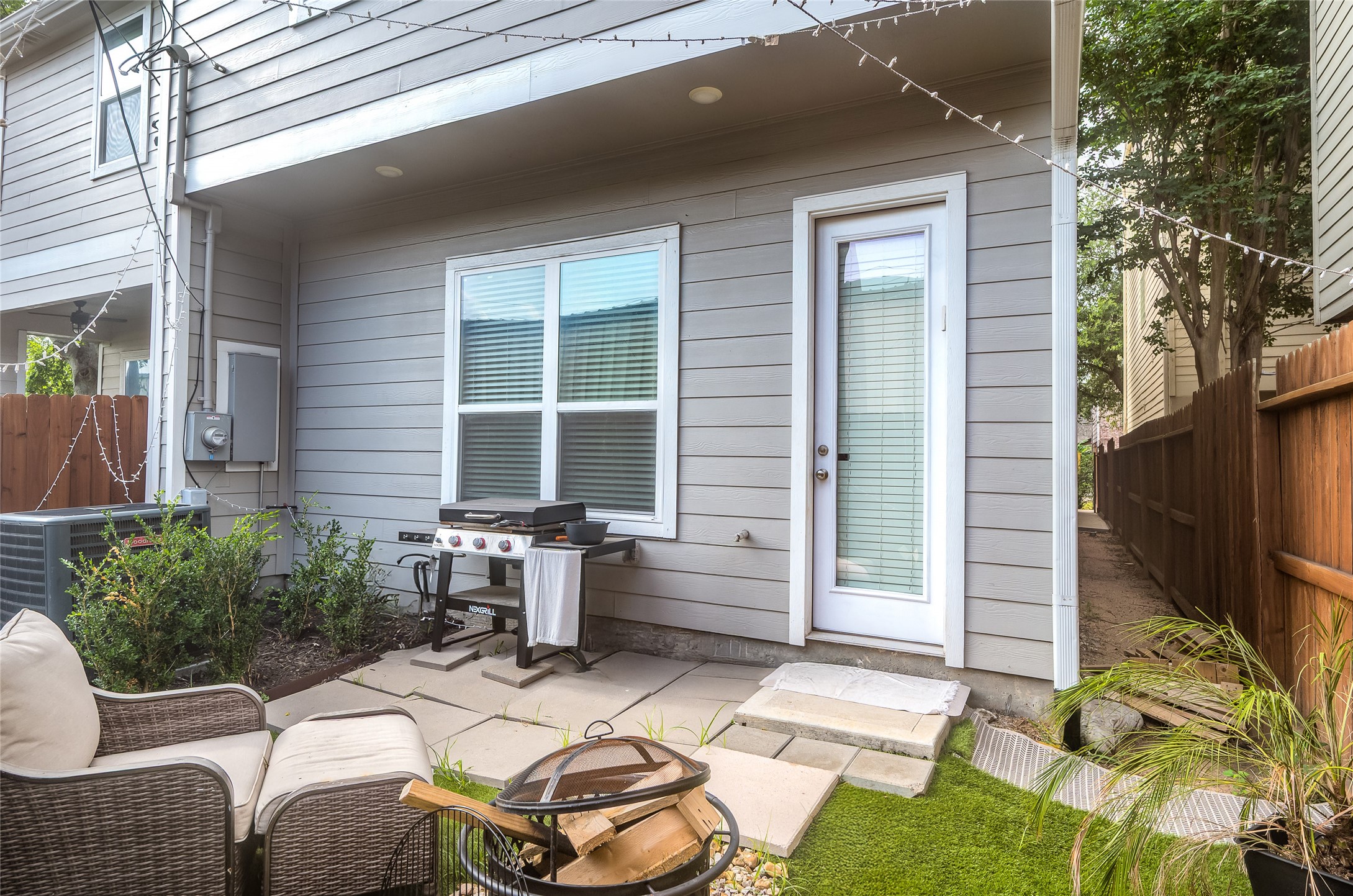 5014 Lillian Street Houston, TX 77007 - Photo 22 of 24 a view of a patio with a table and chairs and potted plants