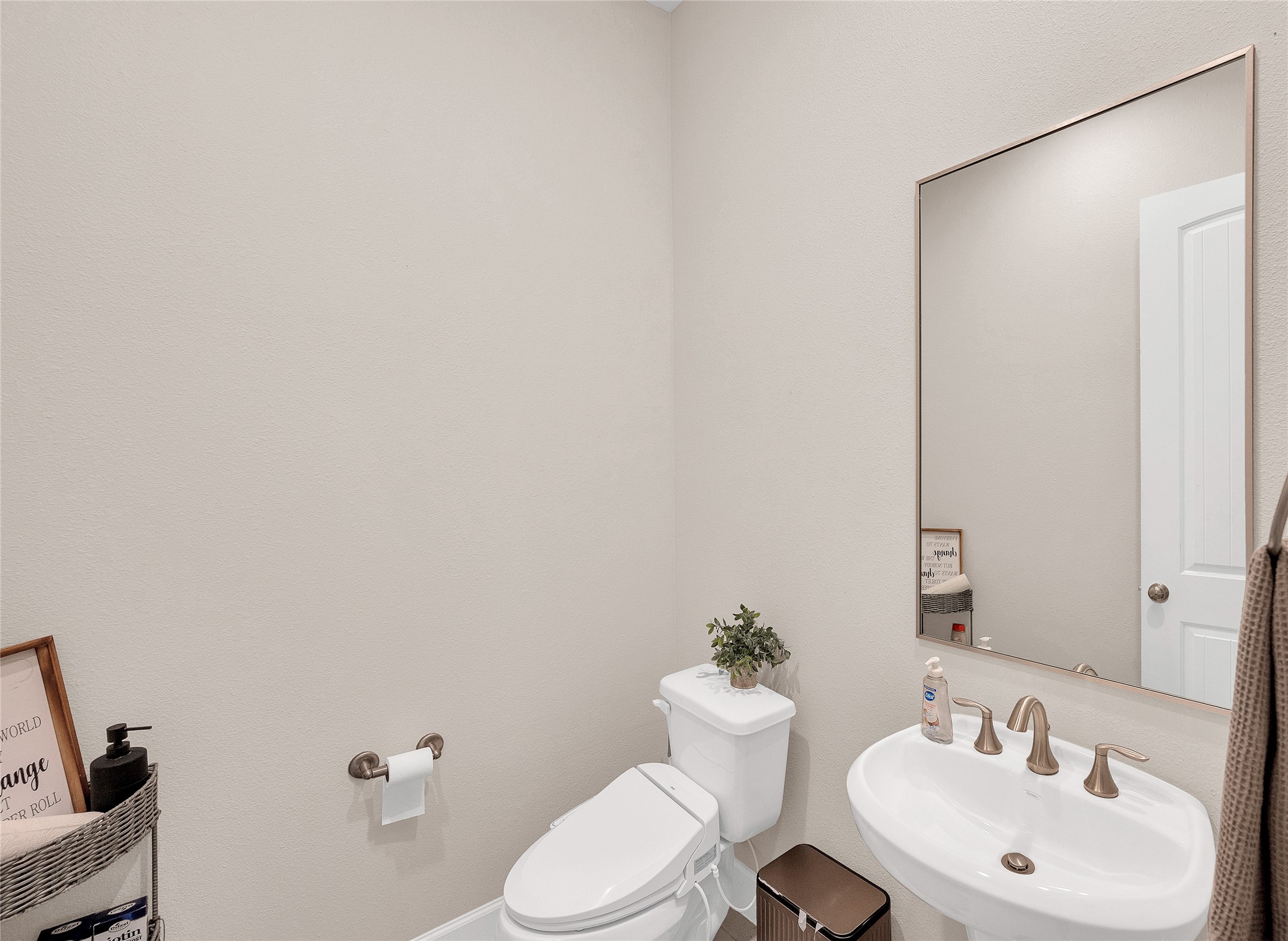 5014 Lillian Street Houston, TX 77007 - Photo 4 of 24 a bathroom with a sink mirror vanity and toilet