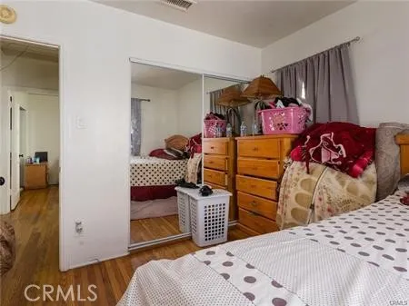 a bedroom with a bed and a closet