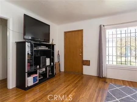 a view of a livingroom with furniture and a flat screen tv