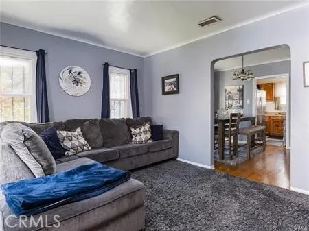 a living room with furniture and a table