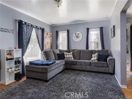 a living room with furniture and a window