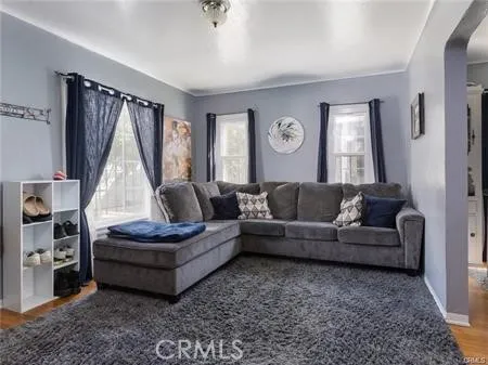 a living room with furniture and a window