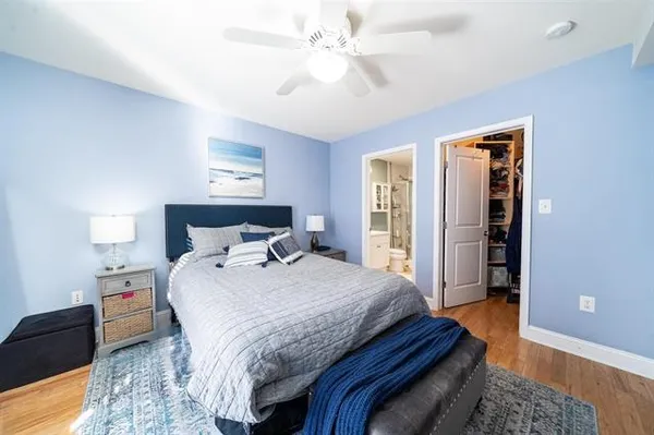 a bedroom with bed and window