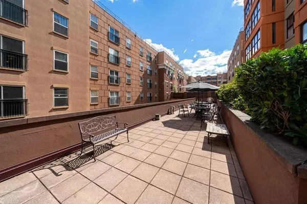 a view of a building with sitting area