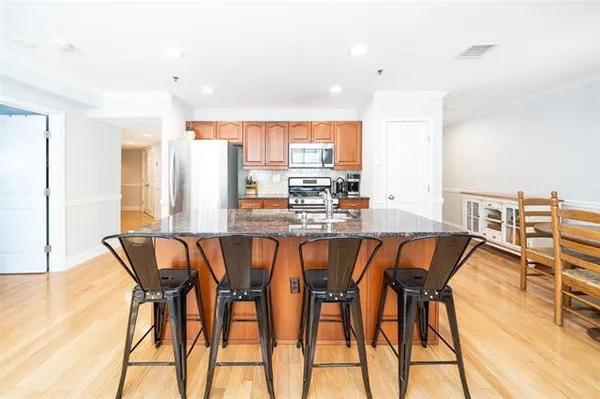 a view of a dining room with furniture and wooden floor