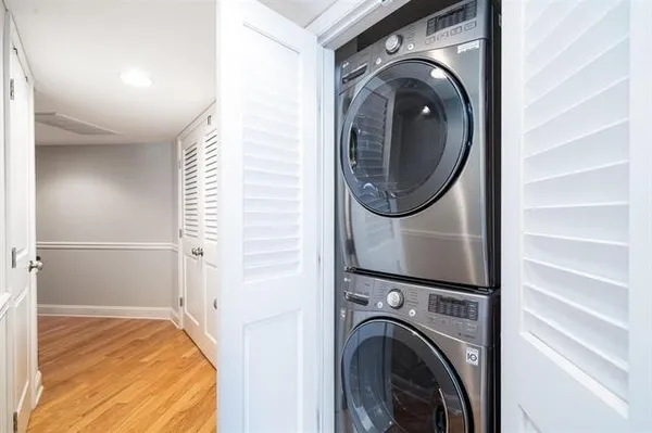 a view of a bedroom with washer and dryer