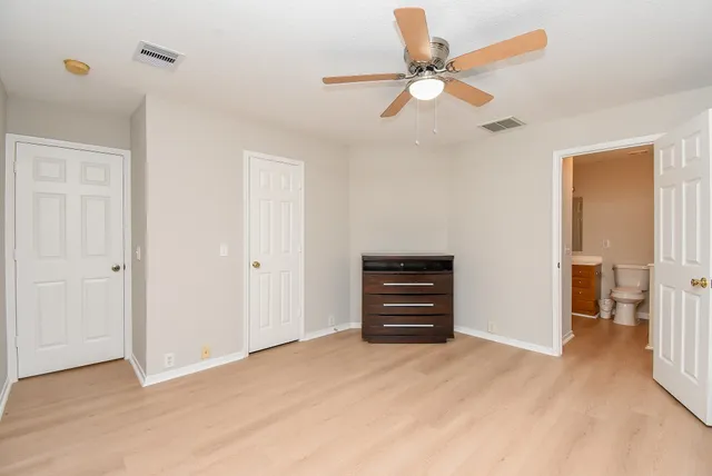a view of room with window and ceiling fan