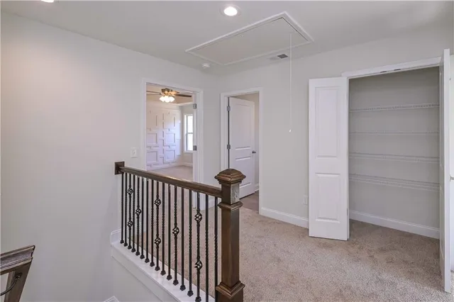 a view of a hallway with windows