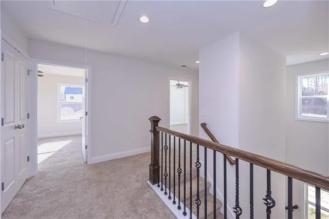 a view of a hallway with windows