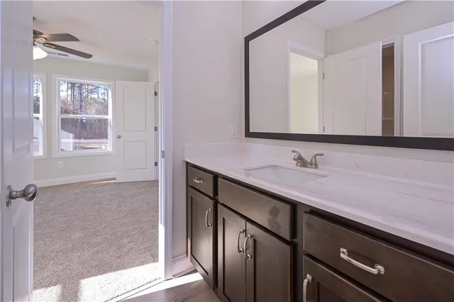 a bathroom with a sink a vanity and a mirror