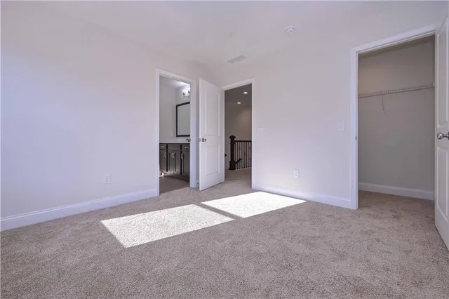 a view of an empty room with an entryway