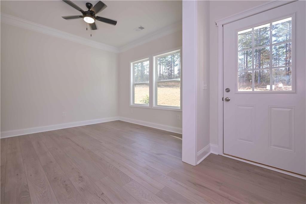 262 Corinth-Five Points Road Buchanan, GA 30113 - Photo 5 of 41 a view of a livingroom with a window and wooden floor