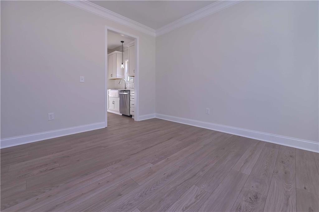 262 Corinth-Five Points Road Buchanan, GA 30113 - Photo 6 of 41 an empty room with wooden floor and a window