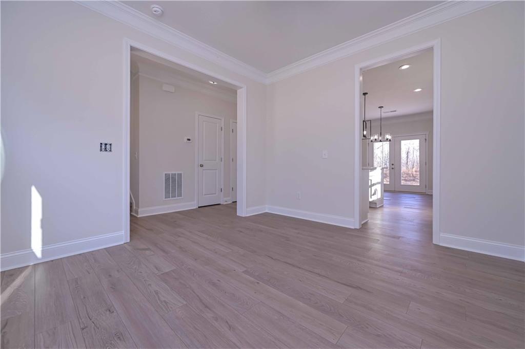 262 Corinth-Five Points Road Buchanan, GA 30113 - Photo 7 of 41 a view of an empty room with wooden floor and a window