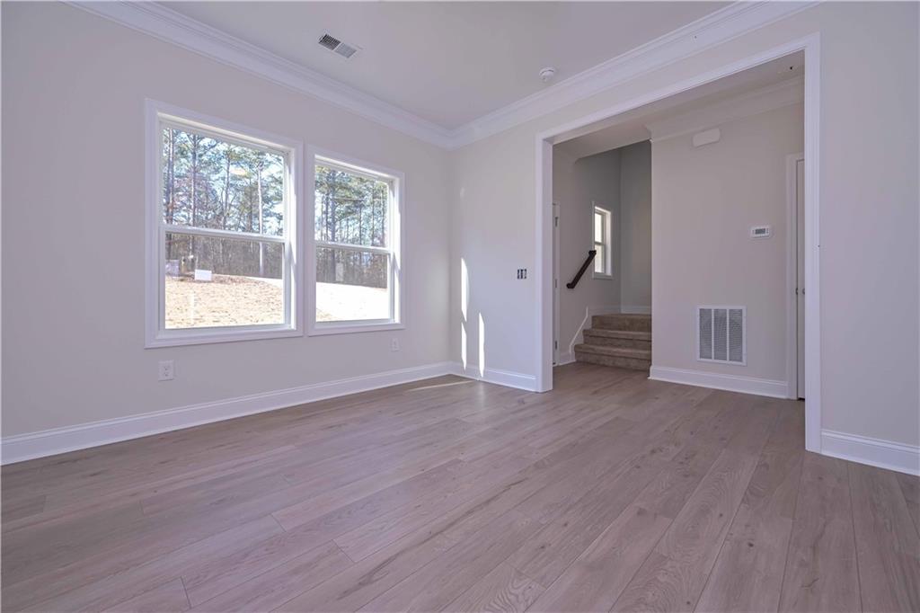 262 Corinth-Five Points Road Buchanan, GA 30113 - Photo 8 of 41 a view of an empty room with wooden floor and a window