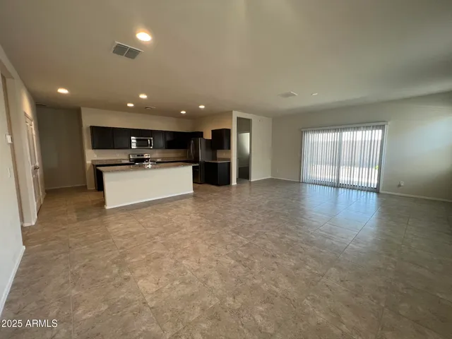 a view of a kitchen with a sink and a stove top oven