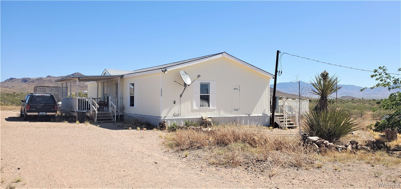 5809 Elfrida Road Golden Valley, AZ 86413 - Photo 3 of 64 a view of a house with a snow in the background