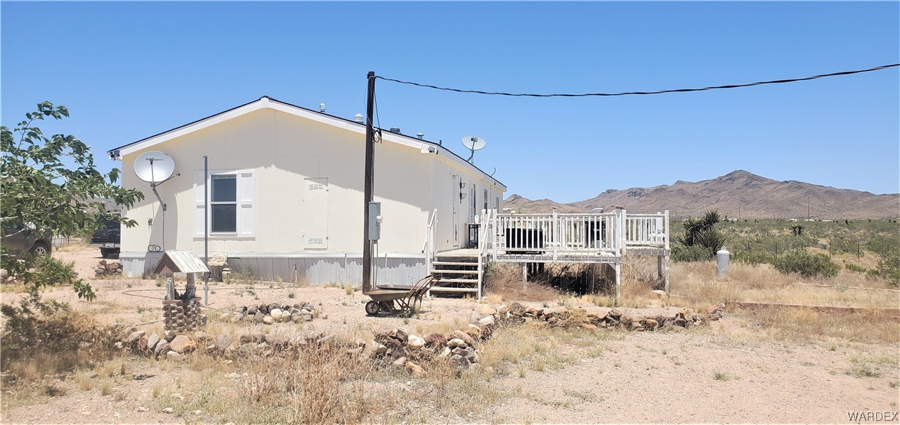 5809 Elfrida Road Golden Valley, AZ 86413 - Photo 6 of 64 a view of a house with a snow in the yard